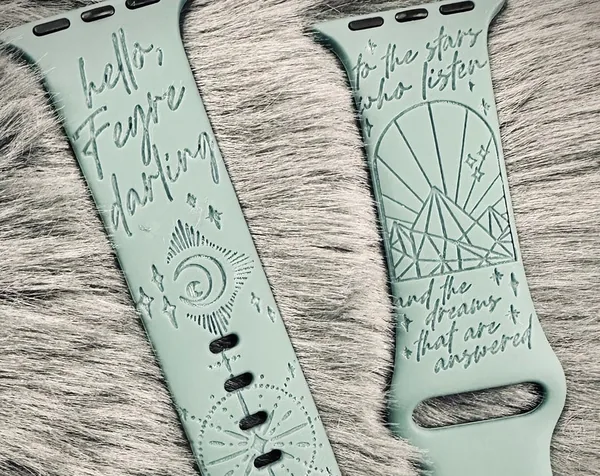 Engraved watch band reading hello Feyre darling.